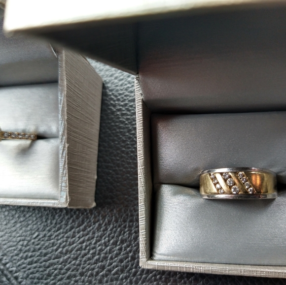 An engagement ring and man's wedding band . - Picture 7 of 10
